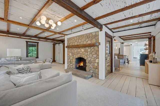 2024 Stratfield Rd, Fairfield, CT 06825 - living area featuring wood-type flooring, beam ceiling, a stone fireplace, and recessed lighting
