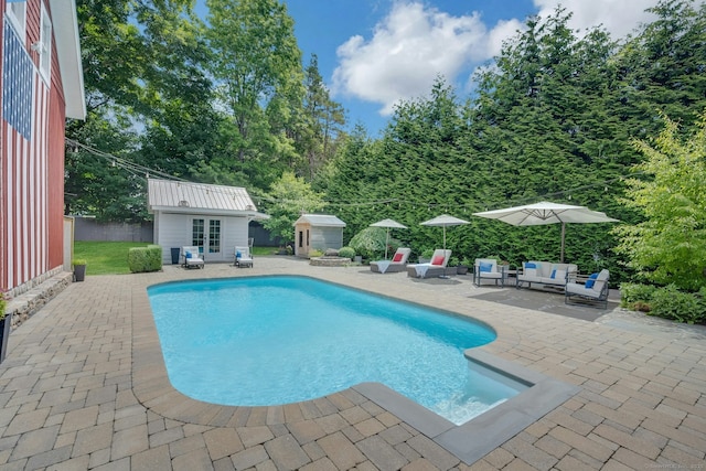2024 Stratfield Rd, Fairfield, CT 06825 - outdoor pool featuring a patio area, an outbuilding, and an outdoor living space