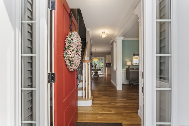 233 Ichabod Rd, Southbury, CT 06488 - foyer entrance with crown molding, wood finished floors, and decorative columns