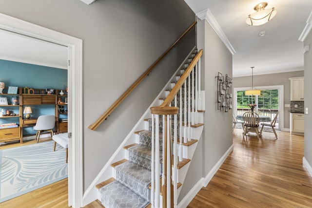 233 Ichabod Rd, Southbury, CT 06488 - stairs with crown molding and wood finished floors