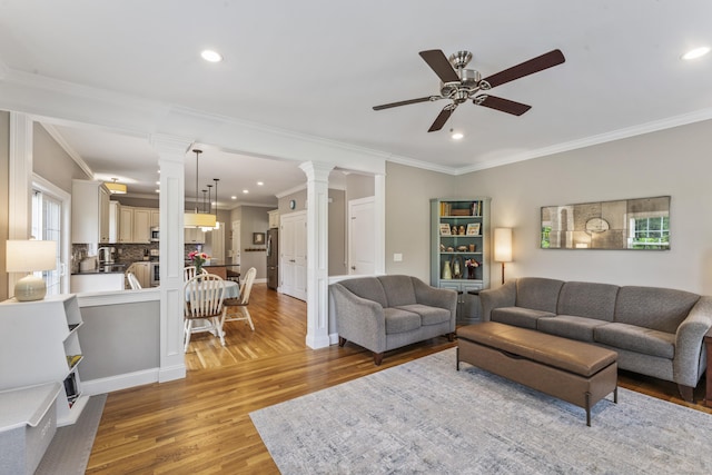 233 Ichabod Rd, Southbury, CT 06488 - living room with ornate columns, ceiling fan, light wood-style flooring, ornamental molding, and recessed lighting