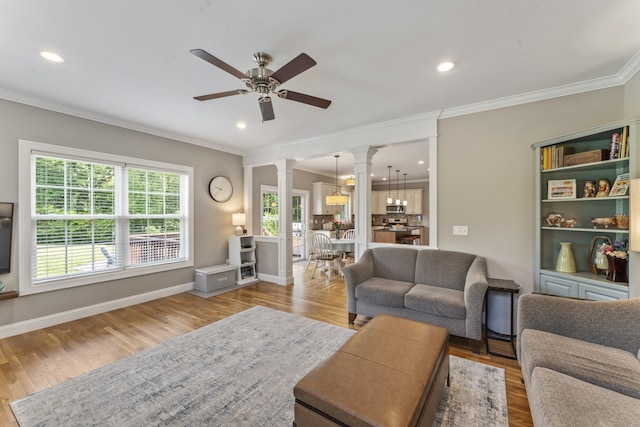 233 Ichabod Rd, Southbury, CT 06488 - living room featuring decorative columns, ornamental molding, ceiling fan, recessed lighting, and wood finished floors