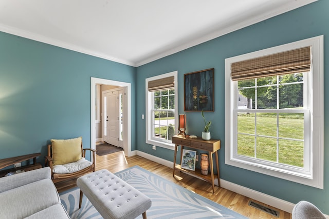 233 Ichabod Rd, Southbury, CT 06488 - living area with plenty of natural light, crown molding, and wood finished floors