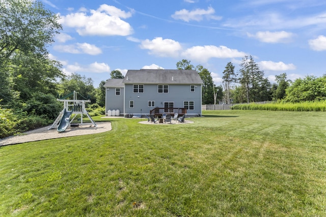 233 Ichabod Rd, Southbury, CT 06488 - rear view of house with a lawn, a patio area, and a playground