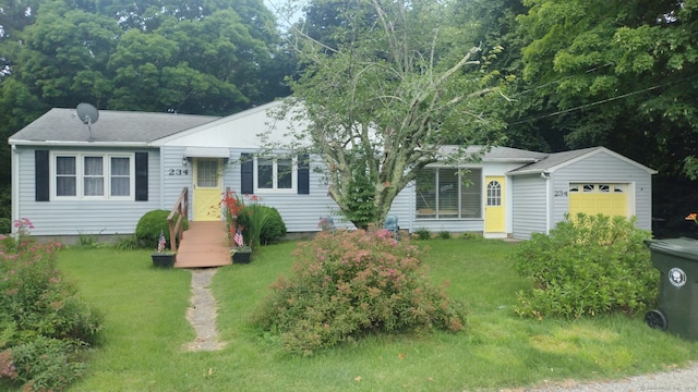 234 Vergason Ave, Norwich, CT 06360 - view of front of property with a garage and a front lawn