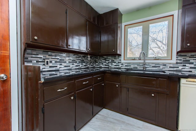 234 Vergason Ave, Norwich, CT 06360 - kitchen with dark countertops, backsplash, dark brown cabinetry, and dishwasher