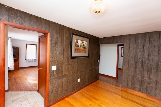 234 Vergason Ave, Norwich, CT 06360 - spare room with wood walls and light wood finished floors