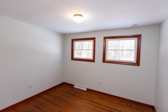 234 Vergason Ave, Norwich, CT 06360 - unfurnished room with dark wood-style flooring and a baseboard radiator