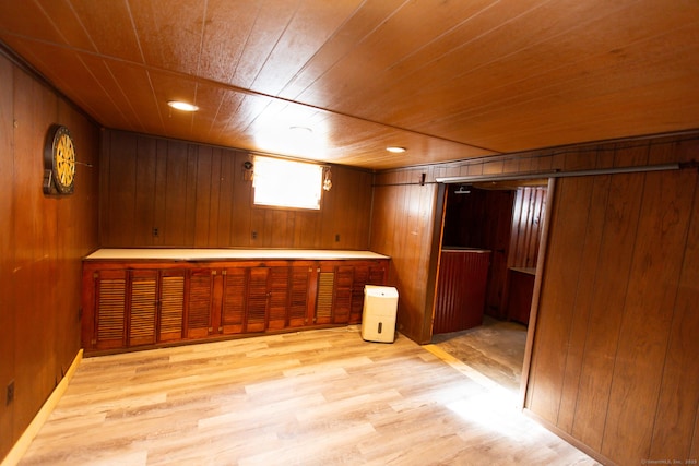 234 Vergason Ave, Norwich, CT 06360 - below grade area with wooden ceiling, wood walls, and light wood-style flooring