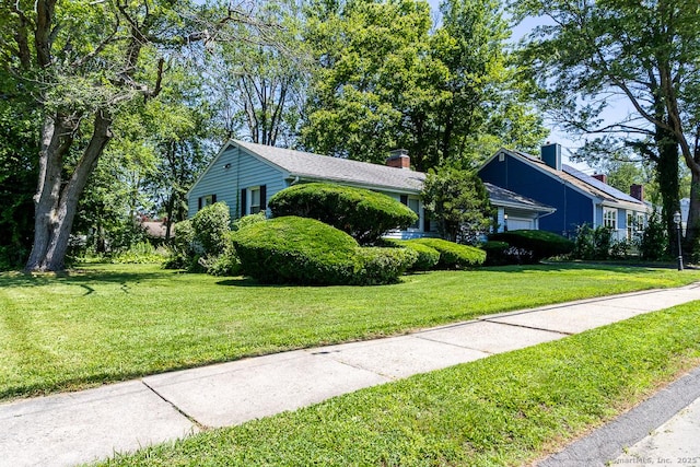 136 Chatham St, Hartford, CT 06112 - view of front of home with a front yard and a chimney