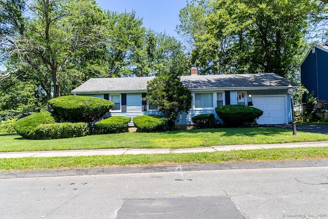 136 Chatham St, Hartford, CT 06112 - ranch-style home featuring a garage, a front yard, a chimney, and asphalt driveway