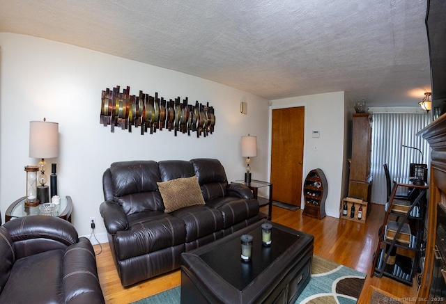 136 Chatham St, Hartford, CT 06112 - living area with wood finished floors and a textured ceiling