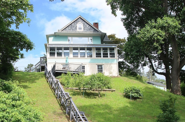 1 Best View Rd, Waterford, CT 06375 - back of house with a sunroom, a chimney, stairway, and a yard