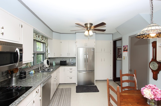 1 Best View Rd, Waterford, CT 06375 - kitchen with appliances with stainless steel finishes, ceiling fan, tasteful backsplash, white cabinets, and dark stone counters