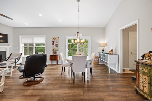 31 Old Oak Ct, Southington, CT 06489 - dining area with a chandelier, dark wood-type flooring, and a fireplace