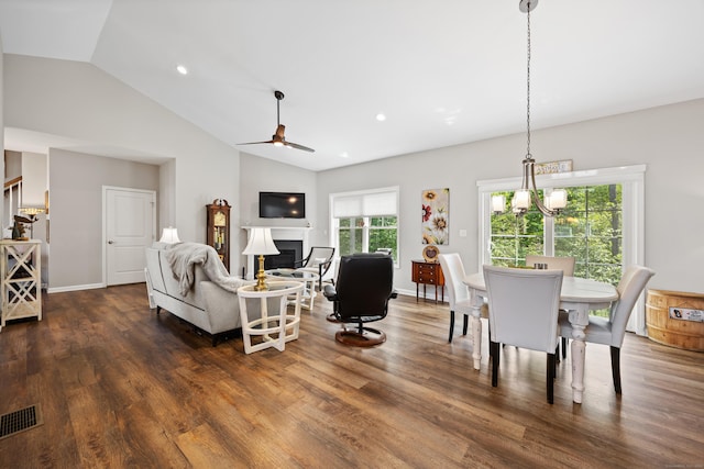 31 Old Oak Ct, Southington, CT 06489 - living room featuring a ceiling fan, dark wood-type flooring, a fireplace, stairs, and a chandelier