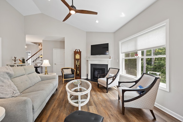 31 Old Oak Ct, Southington, CT 06489 - living area featuring plenty of natural light, stairway, vaulted ceiling, a fireplace with flush hearth, and dark wood-style floors