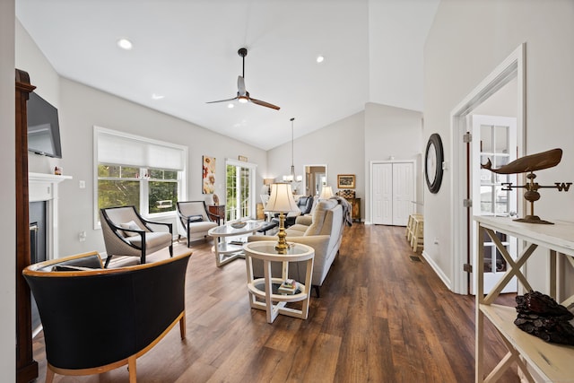 31 Old Oak Ct, Southington, CT 06489 - living area with a glass covered fireplace, ceiling fan, high vaulted ceiling, dark wood finished floors, and recessed lighting