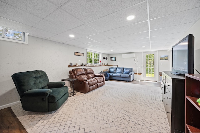 31 Old Oak Ct, Southington, CT 06489 - living area with a wall unit AC, a drop ceiling, wood finished floors, and recessed lighting
