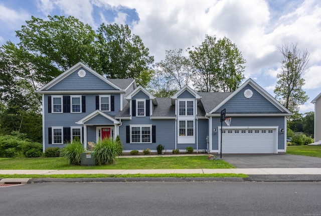 31 Old Oak Ct, Southington, CT 06489 - view of front of home with asphalt driveway, an attached garage, and a front lawn