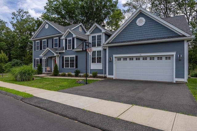 31 Old Oak Ct, Southington, CT 06489 - view of front of home featuring driveway, an attached garage, and a front lawn