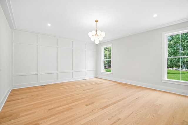 28 Pin Oak Ct, Westport, CT 06880 - empty room with a chandelier, light wood finished floors, a decorative wall, and recessed lighting