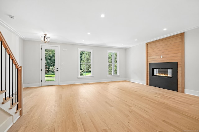 28 Pin Oak Ct, Westport, CT 06880 - unfurnished living room featuring stairs, crown molding, light wood-style flooring, a fireplace, and recessed lighting