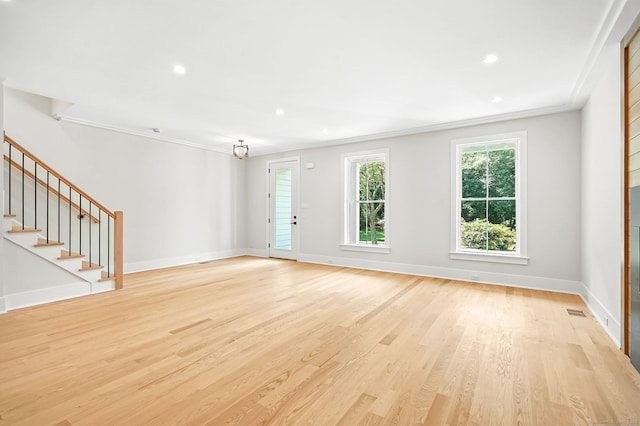 28 Pin Oak Ct, Westport, CT 06880 - unfurnished living room with crown molding, light wood-style floors, stairs, and recessed lighting