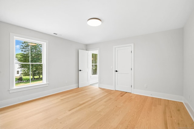 28 Pin Oak Ct, Westport, CT 06880 - empty room featuring light wood-style floors and baseboards