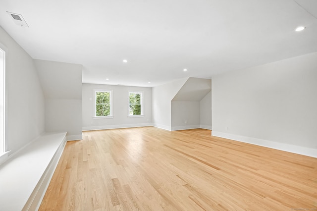 28 Pin Oak Ct, Westport, CT 06880 - additional living space with light wood-type flooring, recessed lighting, and lofted ceiling