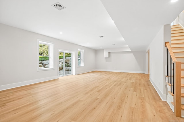 28 Pin Oak Ct, Westport, CT 06880 - unfurnished living room with stairs, light wood-type flooring, and recessed lighting
