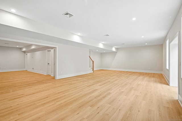 28 Pin Oak Ct, Westport, CT 06880 - below grade area featuring stairway, light wood finished floors, and recessed lighting