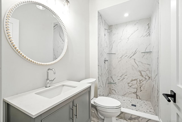 28 Pin Oak Ct, Westport, CT 06880 - bathroom featuring vanity, recessed lighting, a marble finish shower, and marble look tiles