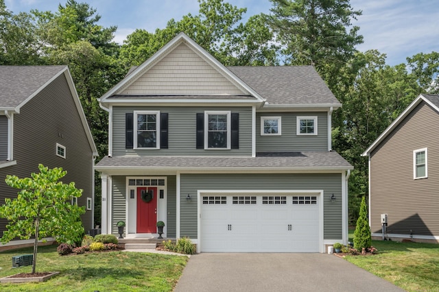 21 Hendricks Ln, Simsbury, CT 06070 - view of front facade with asphalt driveway, a garage, roof with shingles, and a front yard