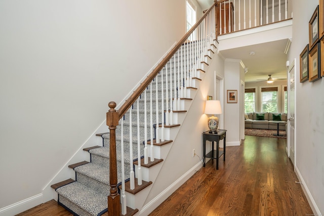 21 Hendricks Ln, Simsbury, CT 06070 - stairway featuring wood finished floors, ceiling fan, ornamental molding, and a towering ceiling