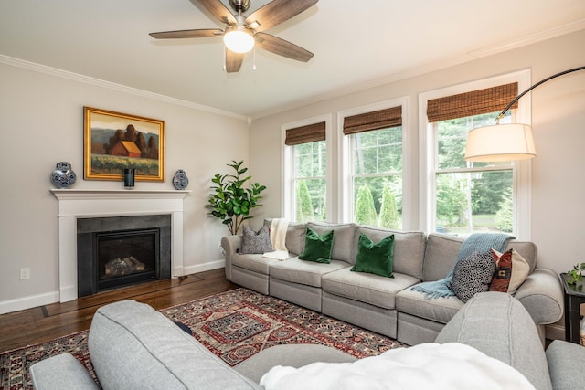 21 Hendricks Ln, Simsbury, CT 06070 - living room with ornamental molding, healthy amount of natural light, wood finished floors, ceiling fan, and a fireplace with flush hearth