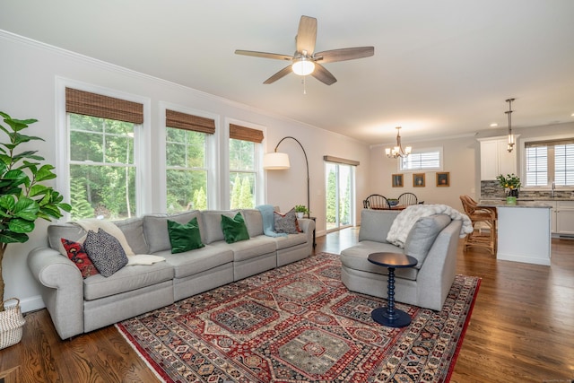 21 Hendricks Ln, Simsbury, CT 06070 - living area featuring ornamental molding, dark wood-style floors, a chandelier, and a ceiling fan