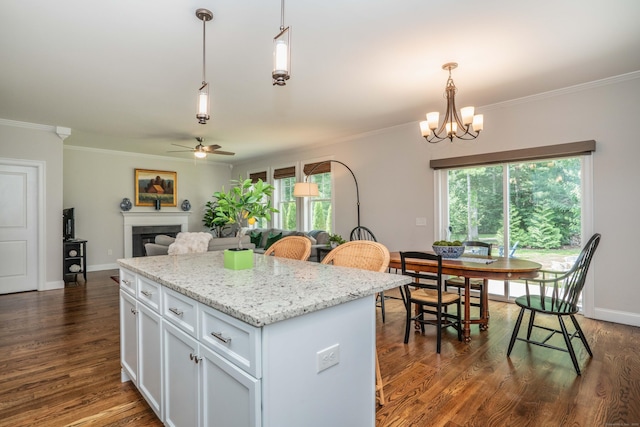 21 Hendricks Ln, Simsbury, CT 06070 - kitchen with a ceiling fan, ornamental molding, white cabinetry, dark wood finished floors, and pendant lighting