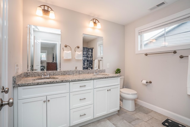 21 Hendricks Ln, Simsbury, CT 06070 - bathroom with double vanity and baseboards