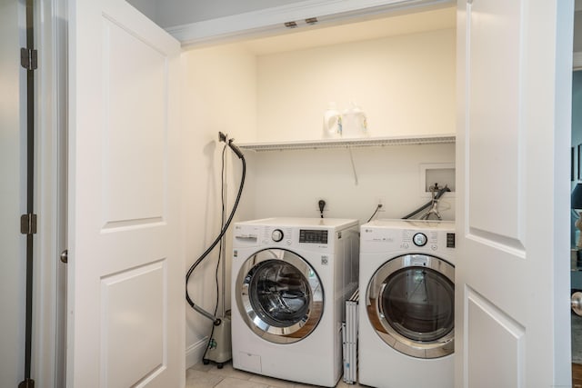 21 Hendricks Ln, Simsbury, CT 06070 - laundry room with washing machine and dryer and light tile patterned flooring