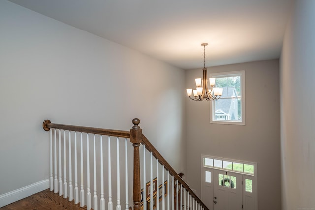 21 Hendricks Ln, Simsbury, CT 06070 - stairs with a chandelier and wood finished floors