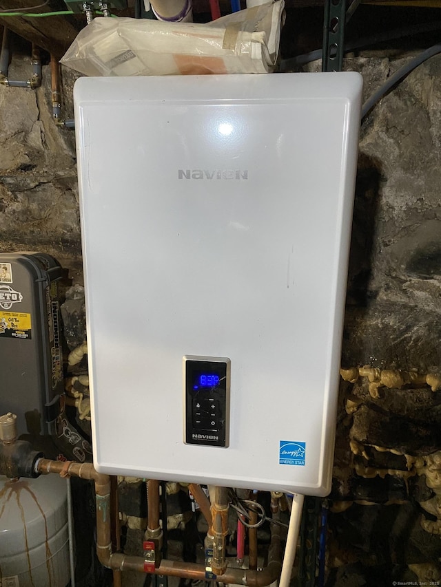 28 Union St, Plymouth, CT 06786 - utility room featuring tankless water heater