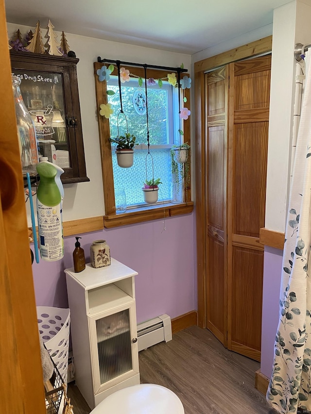 28 Union St, Plymouth, CT 06786 - bathroom featuring baseboard heating, wood finished floors, and a baseboard radiator