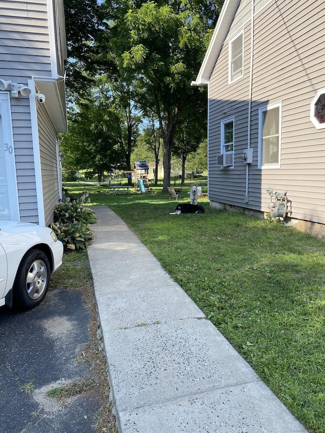 28 Union St, Plymouth, CT 06786 - view of green lawn with a playground and cooling unit