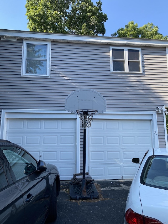 28 Union St, Plymouth, CT 06786 - view of front of property with an attached garage and driveway