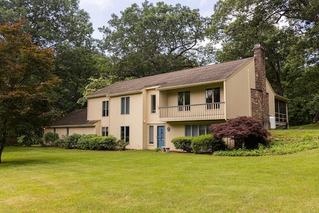 472 Saw Mill Rd, Guilford, CT 06437 - view of front of property with a chimney, a balcony, a front lawn, and roof with shingles