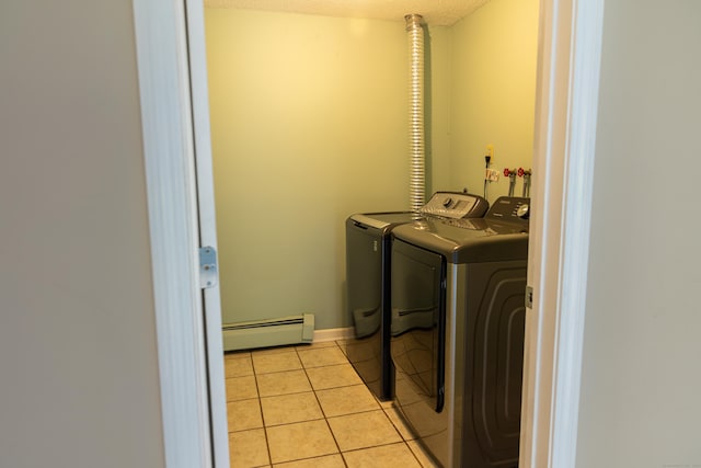 472 Saw Mill Rd, Guilford, CT 06437 - laundry room with a baseboard radiator, washer and dryer, light tile patterned flooring, and a textured ceiling