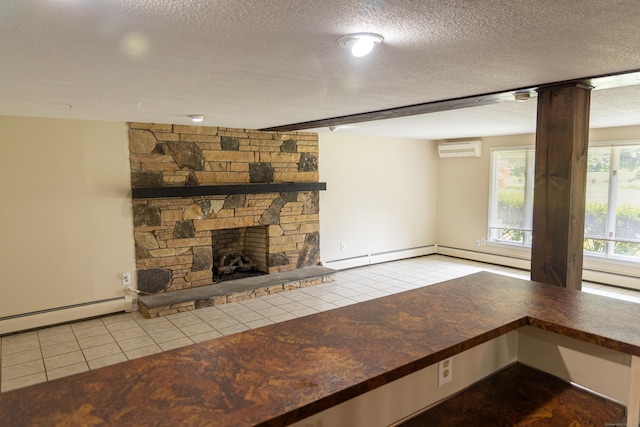 472 Saw Mill Rd, Guilford, CT 06437 - unfurnished living room with a wall mounted air conditioner, a textured ceiling, tile patterned floors, baseboard heating, and a stone fireplace