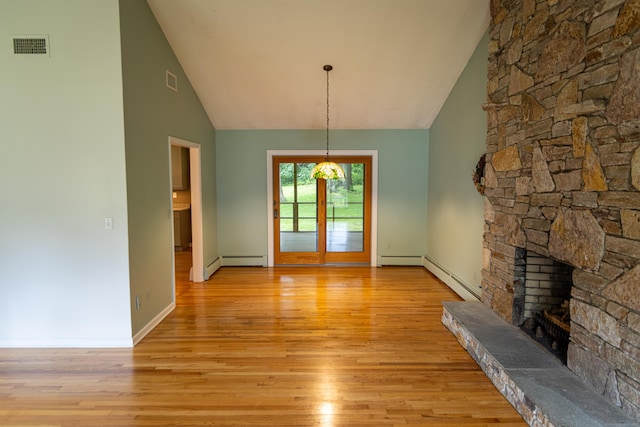 472 Saw Mill Rd, Guilford, CT 06437 - unfurnished living room featuring high vaulted ceiling, a fireplace, light wood finished floors, and a baseboard heating unit