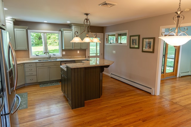 472 Saw Mill Rd, Guilford, CT 06437 - kitchen with baseboard heating, freestanding refrigerator, light wood-type flooring, light stone counters, and recessed lighting